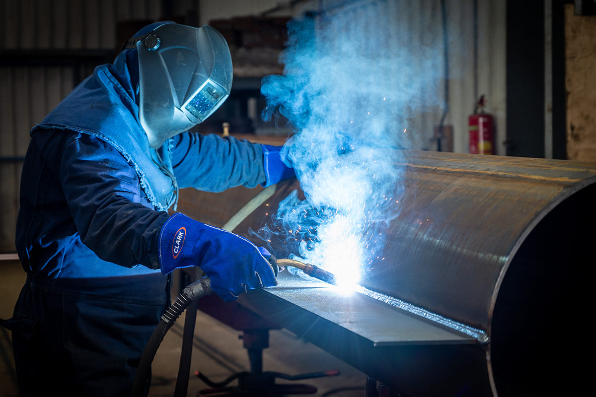 Steel fins being welded to tube